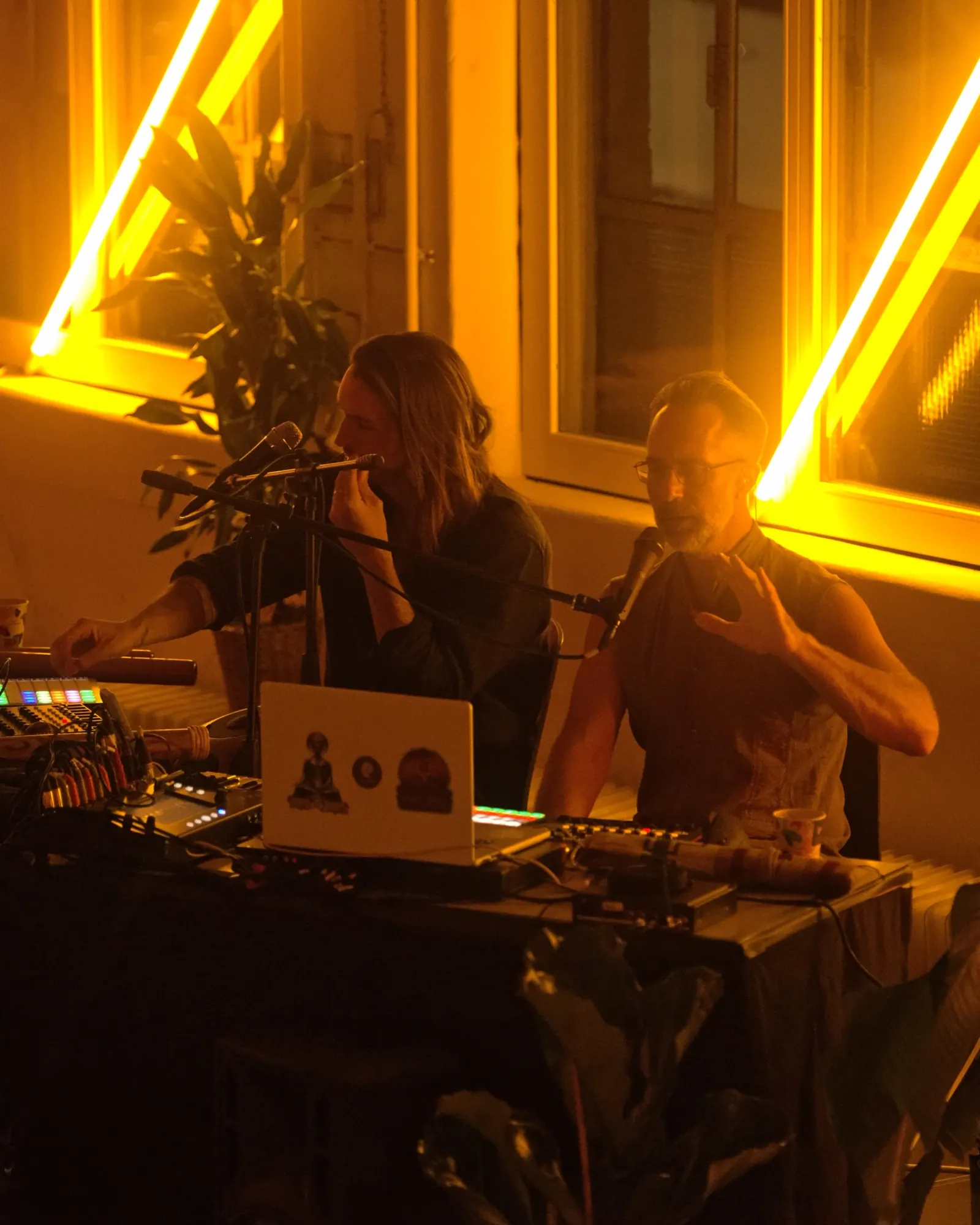 Sandy and Alex King-Harris under warm neon light on opening night in Munich